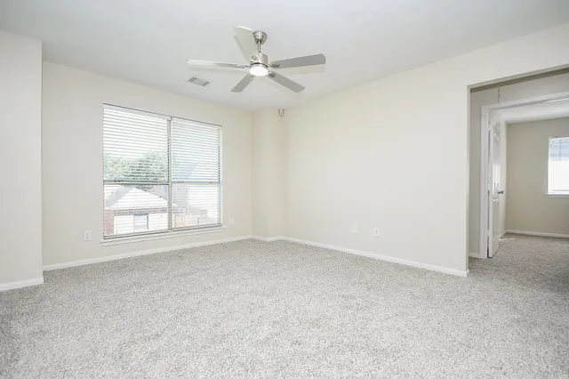 a white bath tub sitting next to a window