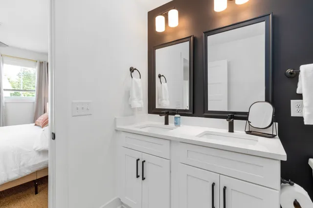 a bathroom with a sink a vanity and mirror