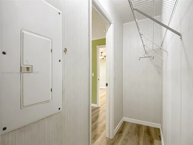a bathroom with a granite countertop double vanity sink and mirror