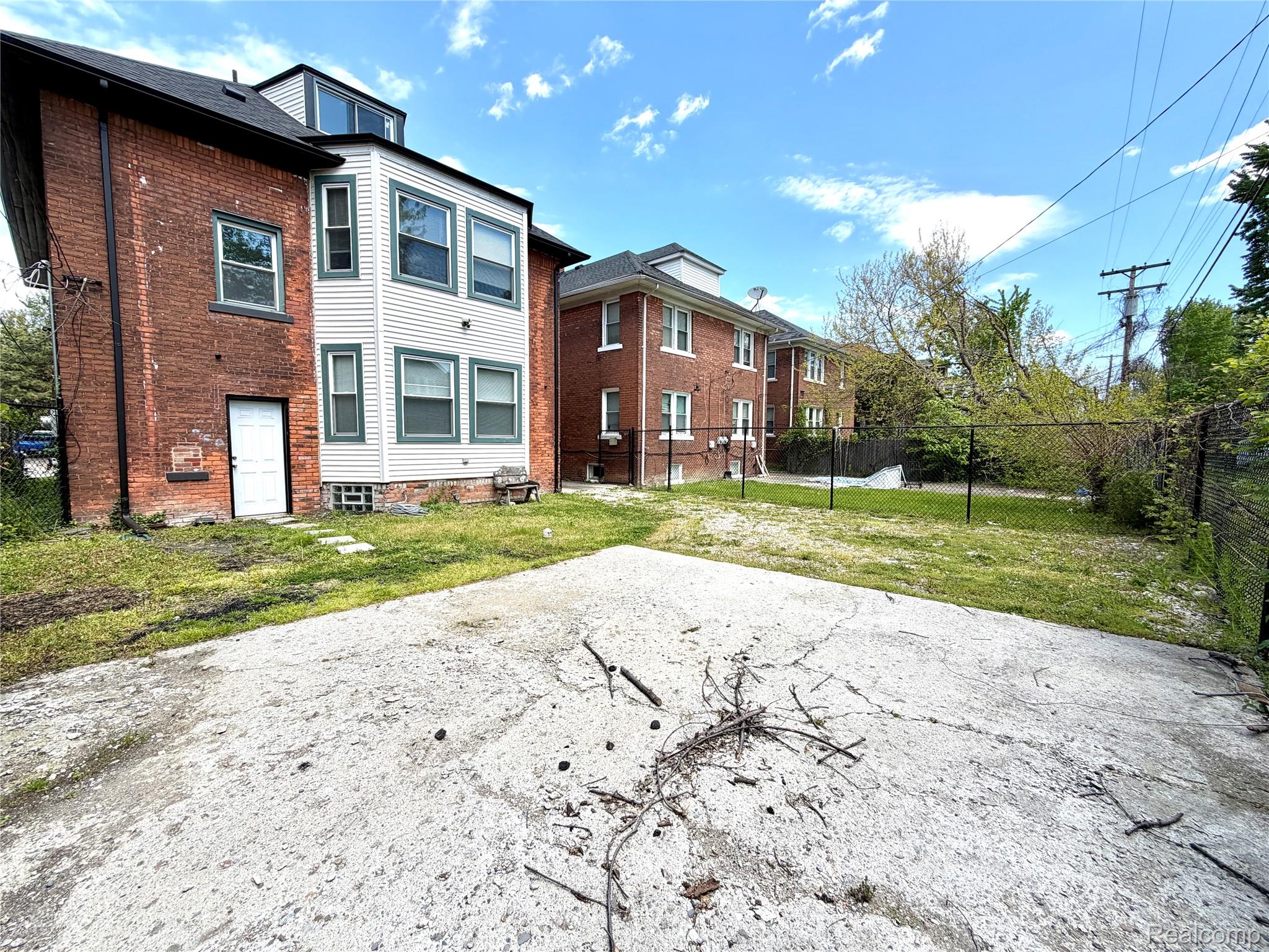 2045 Calvert Avenue Detroit, MI 48206 - Photo 35 of 41 Rear view of house with brick siding