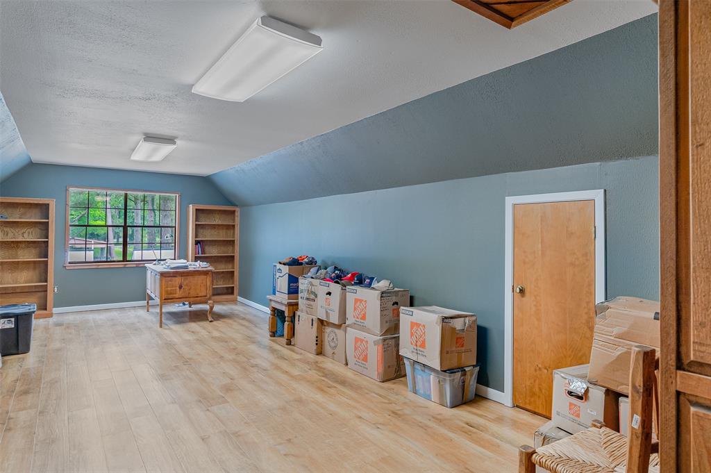 10307 Pirogue Road Oil City, LA 71061 - Photo 21 of 36 wooden floor in a room with a window