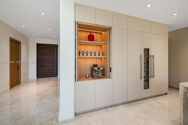 a bedroom with a large bed and a flat screen tv