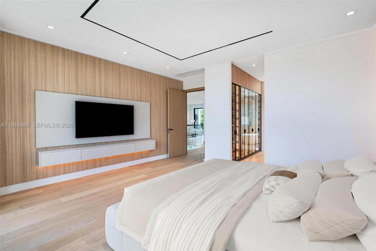 1344 Southwest 16th Street Miami, FL 33145 - Photo 12 of 12 a bedroom with a large bed and a flat screen tv