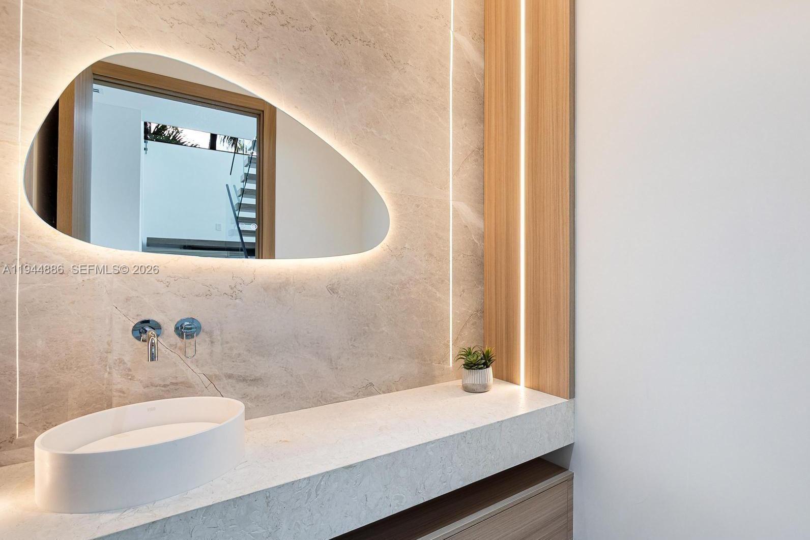 1344 Southwest 16th Street Miami, FL 33145 - Photo 26 of 37 a bathroom with a sink and a mirror