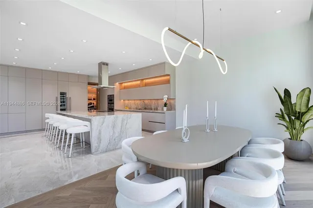 a large kitchen with granite countertop a large window