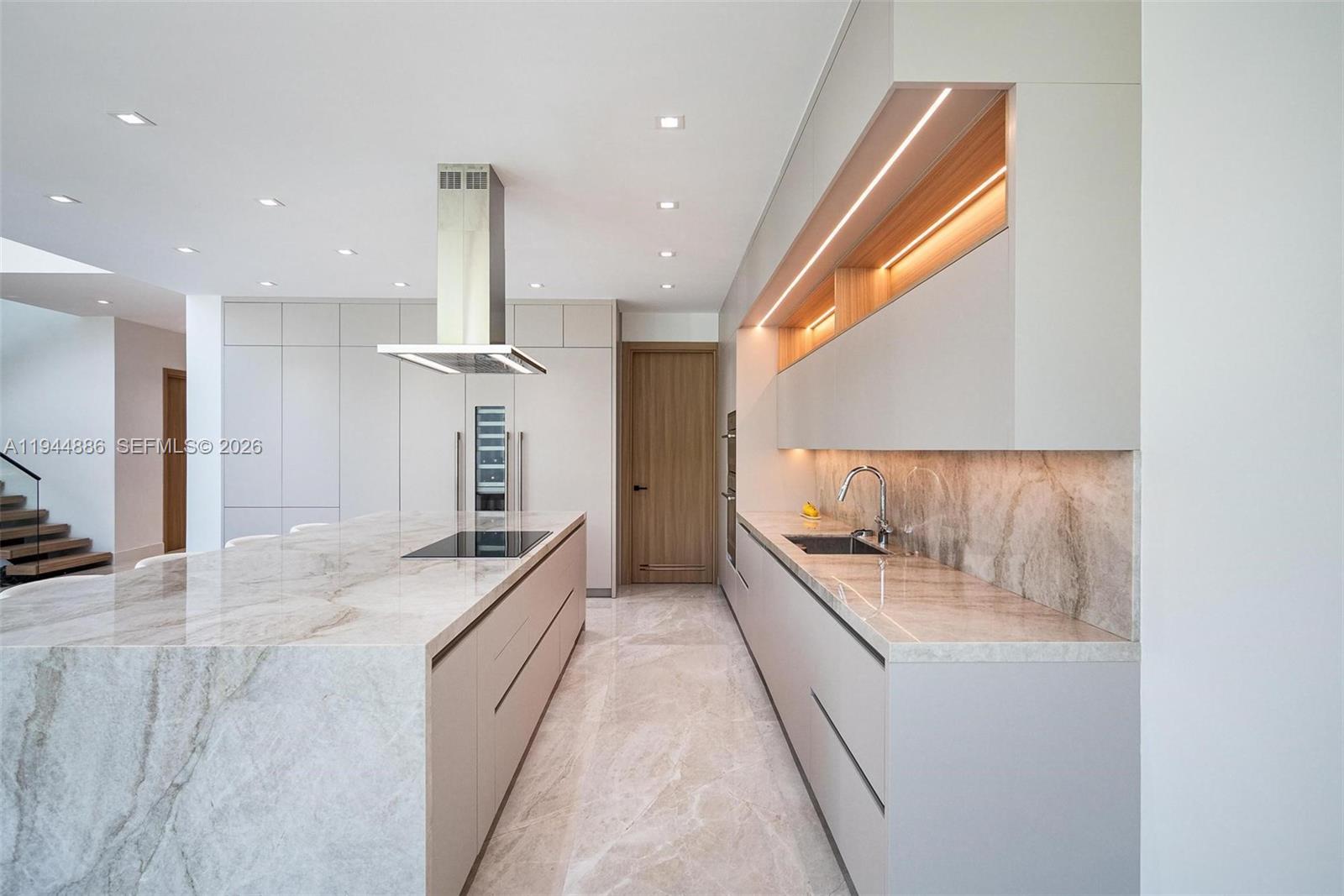 1344 Southwest 16th Street Miami, FL 33145 - Photo 10 of 37 a large kitchen with a large counter top and stainless steel appliances