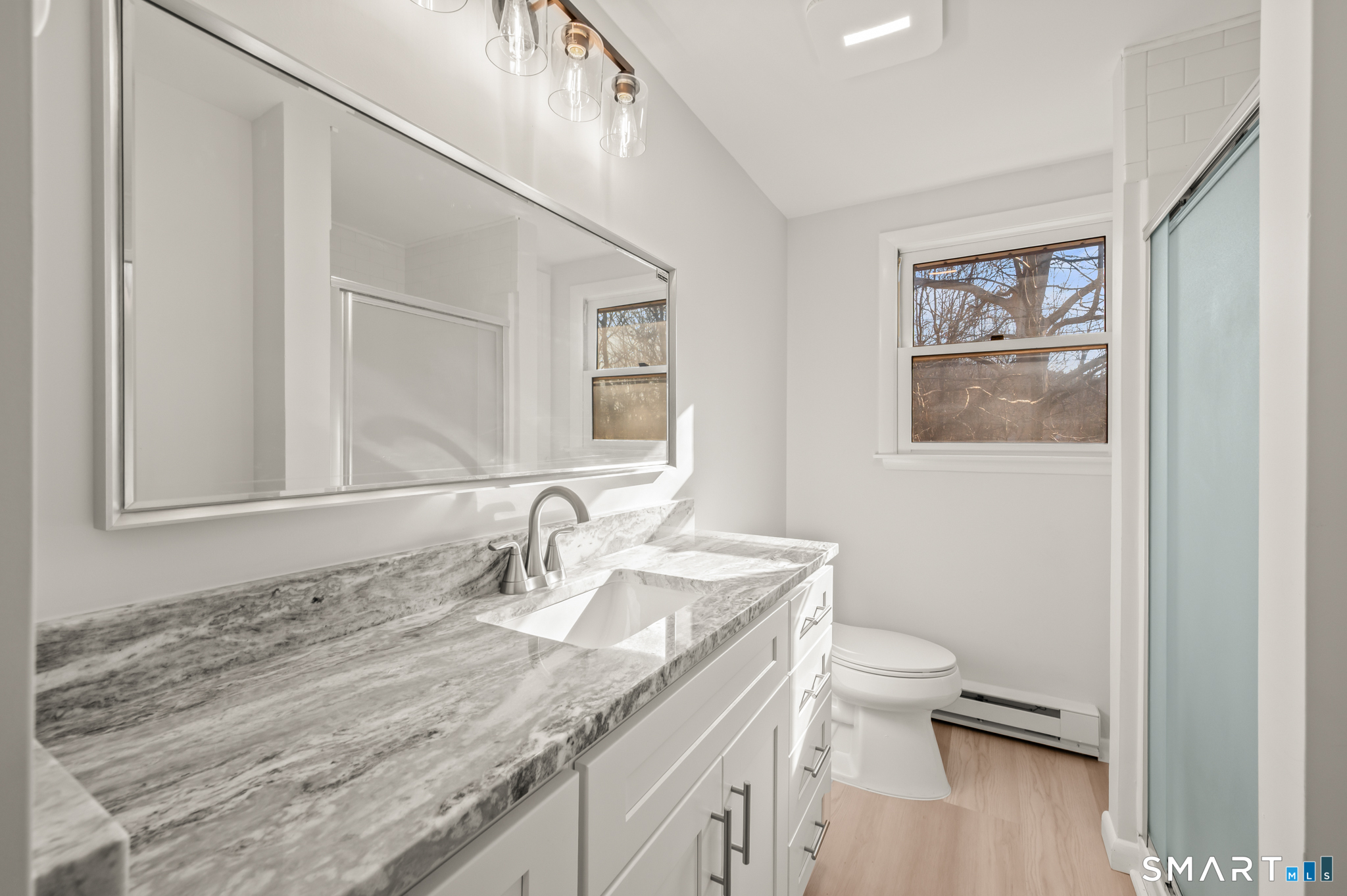 90 Pinnacle Road Plainville, CT 06062 - Photo 14 of 38 a bathroom with a granite countertop sink toilet and a mirror