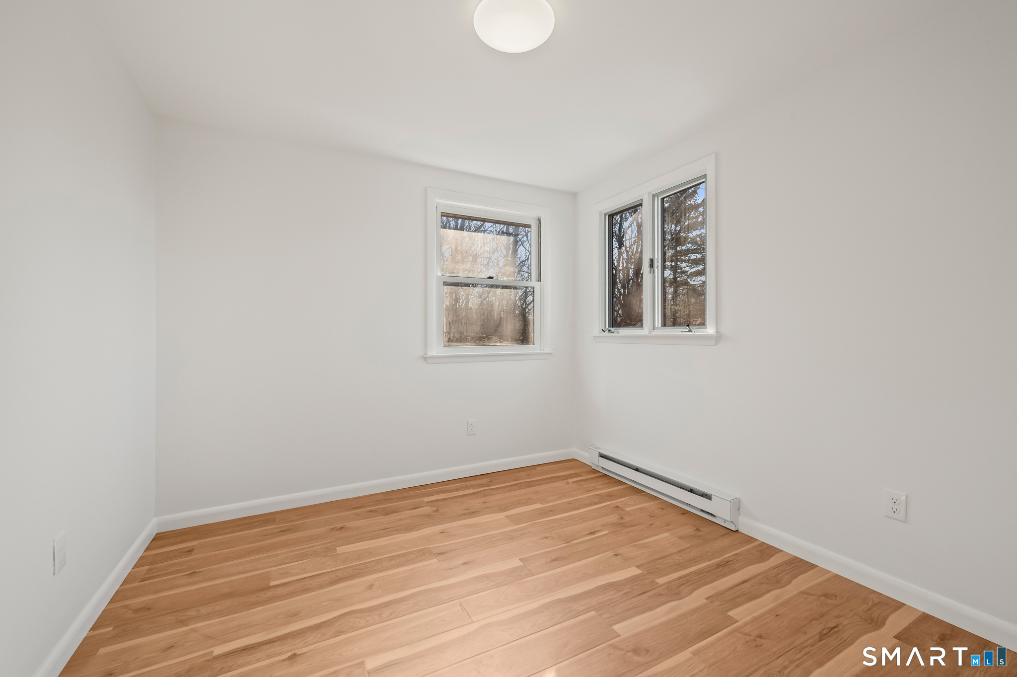 90 Pinnacle Road Plainville, CT 06062 - Photo 15 of 38 a view of empty room with wooden floor