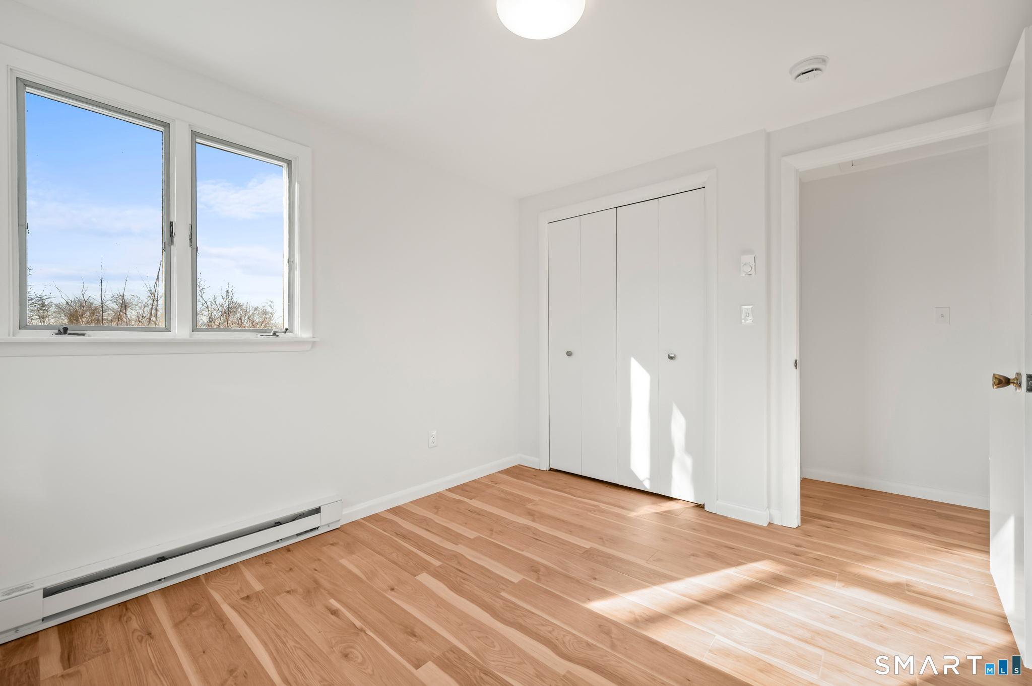 90 Pinnacle Road Plainville, CT 06062 - Photo 17 of 38 a view of an empty room with a window