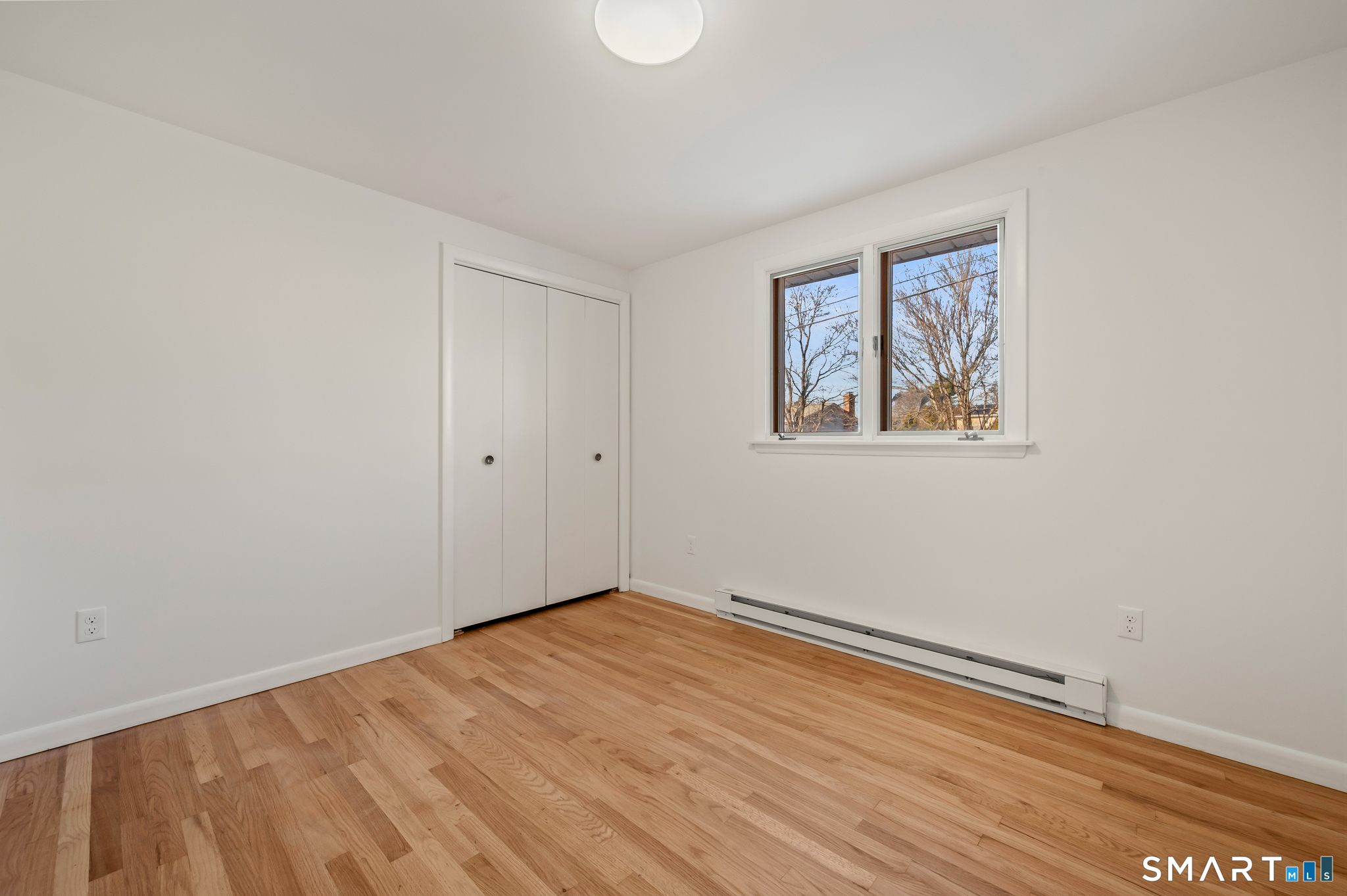 90 Pinnacle Road Plainville, CT 06062 - Photo 19 of 38 a view of empty room with wooden floor