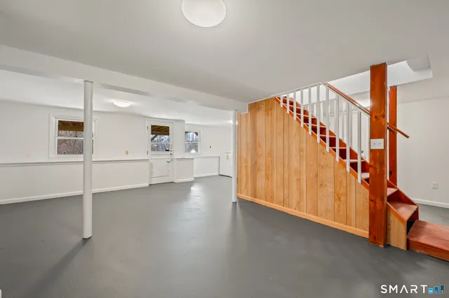 a view of an entryway with wooden floor