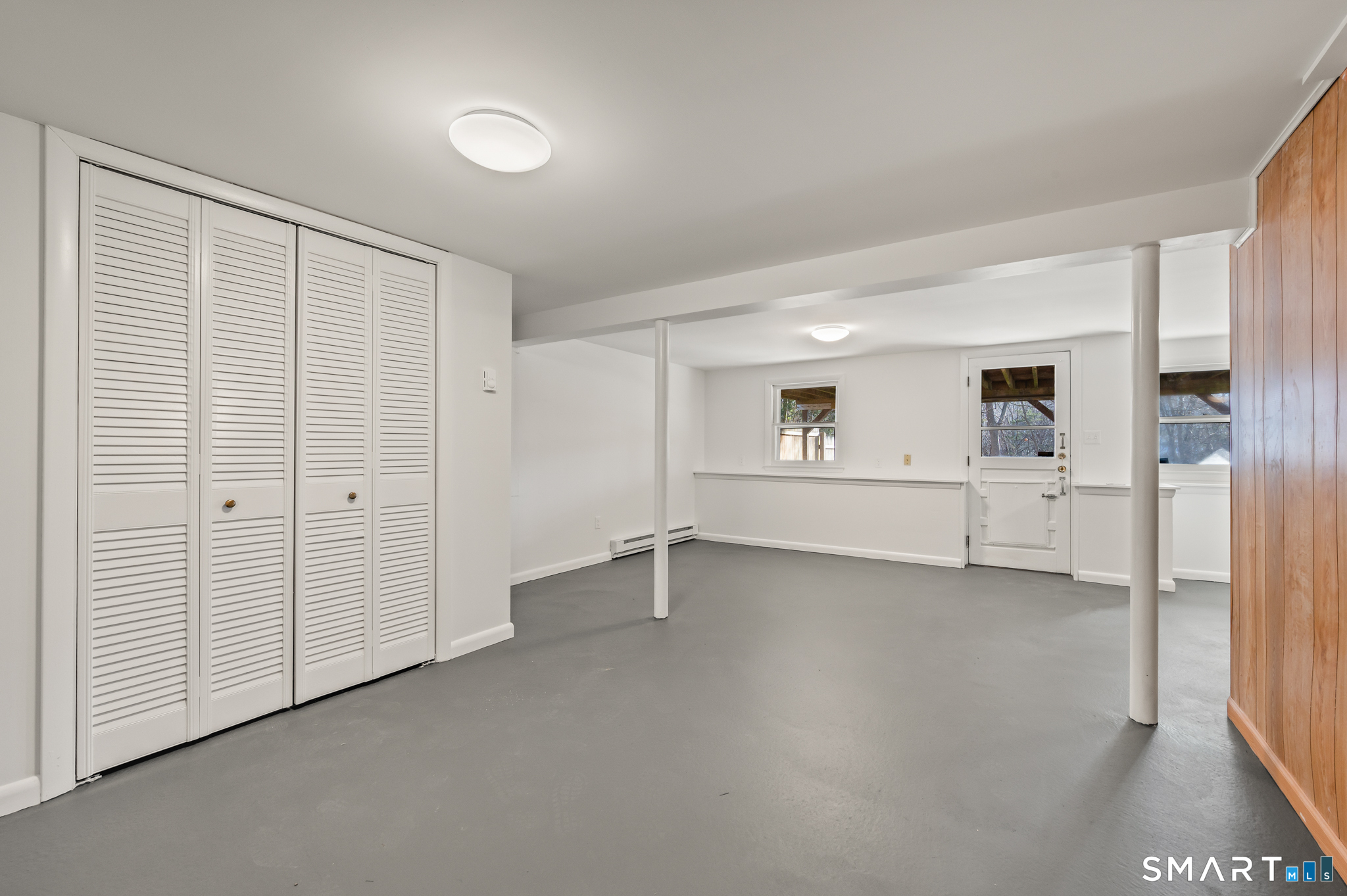 90 Pinnacle Road Plainville, CT 06062 - Photo 22 of 38 an empty room with closet and windows