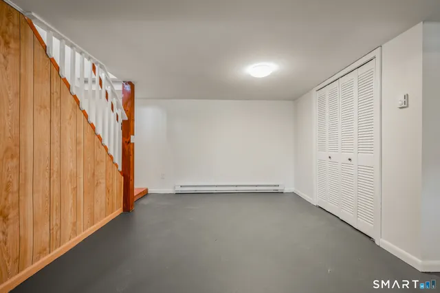 a view of an empty room with stairs