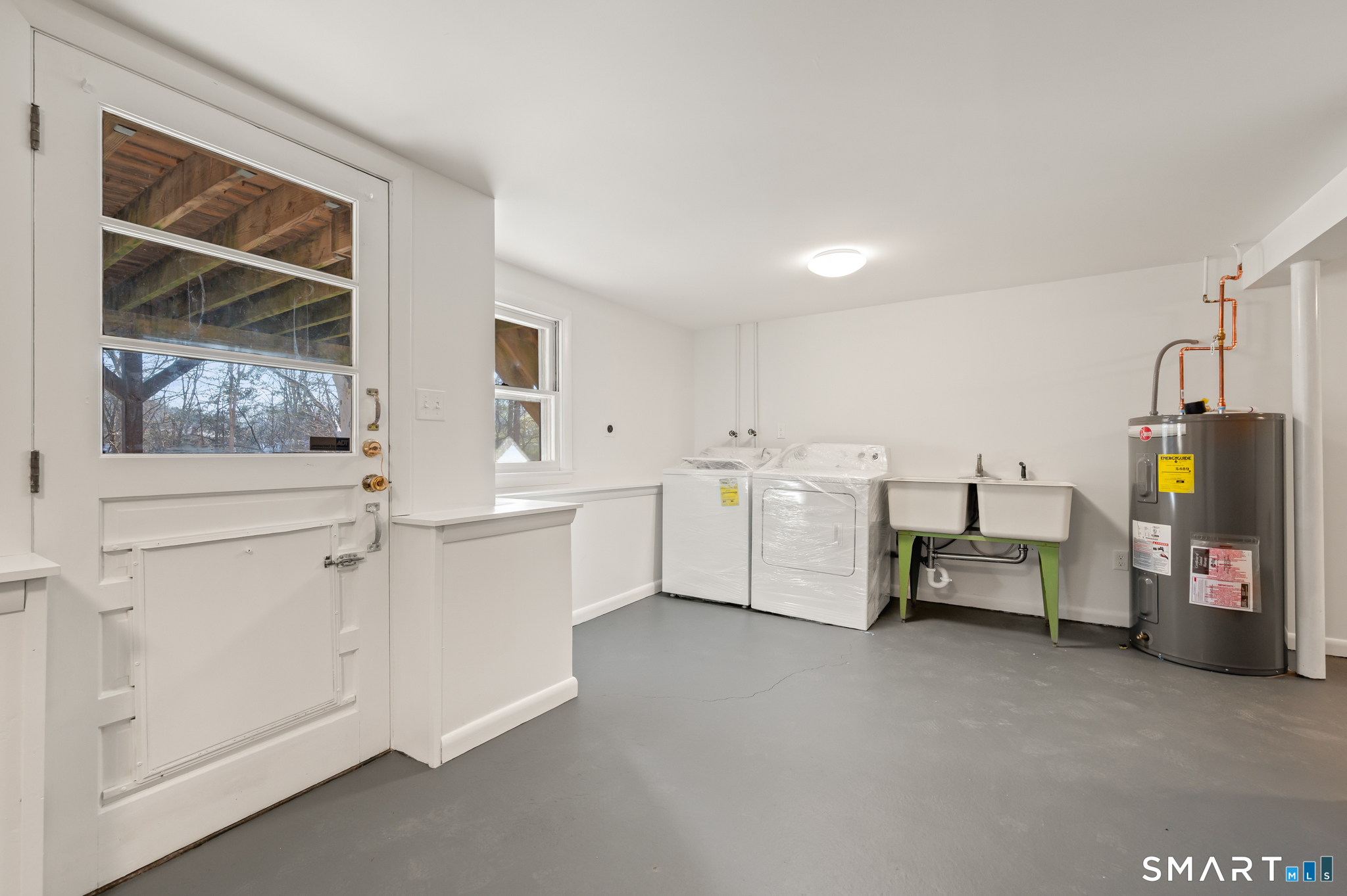90 Pinnacle Road Plainville, CT 06062 - Photo 25 of 38 a utility room with cabinets dryer and washer