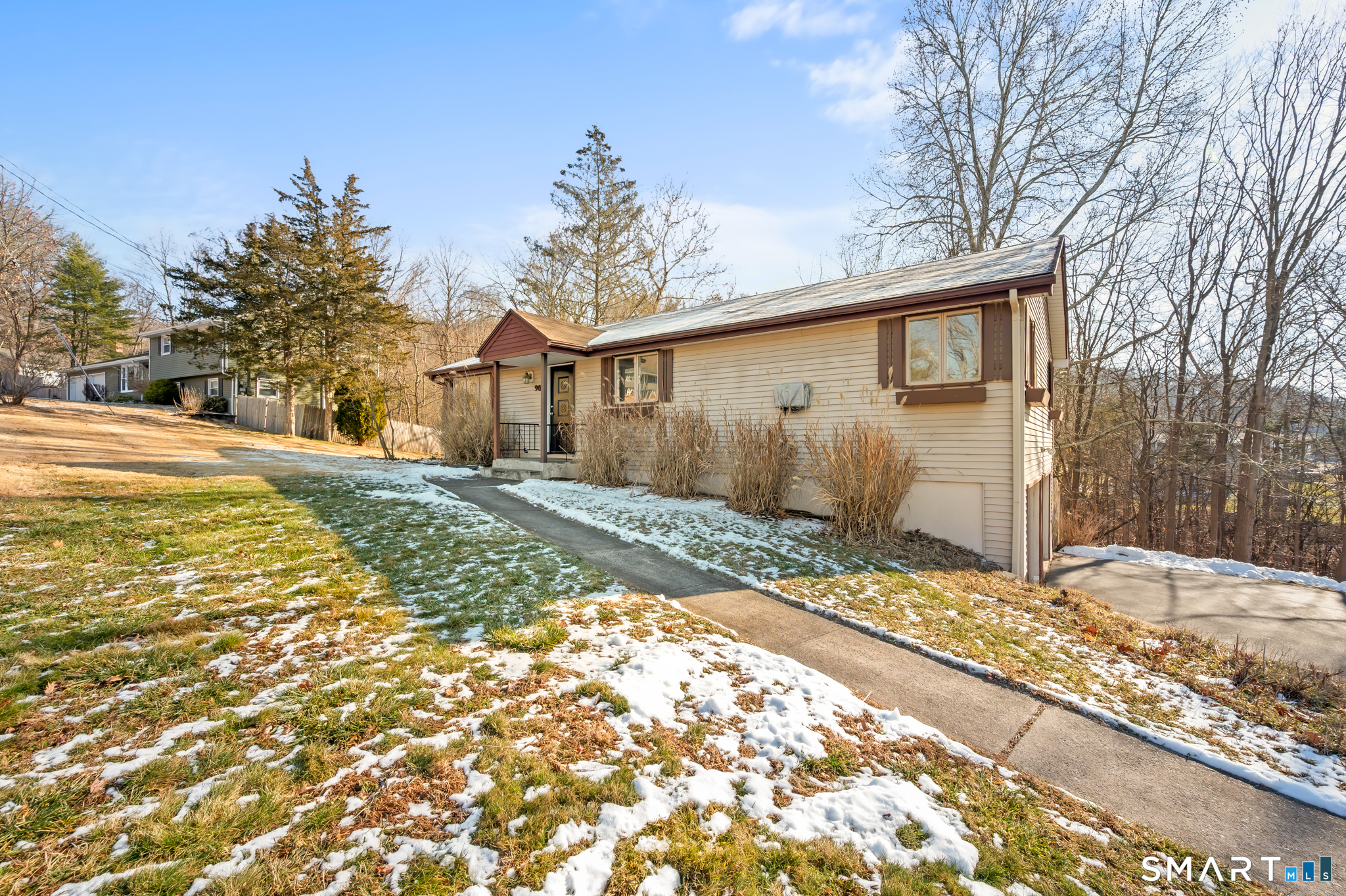 90 Pinnacle Road Plainville, CT 06062 - Photo 34 of 38 a front view of a house with a yard and garage