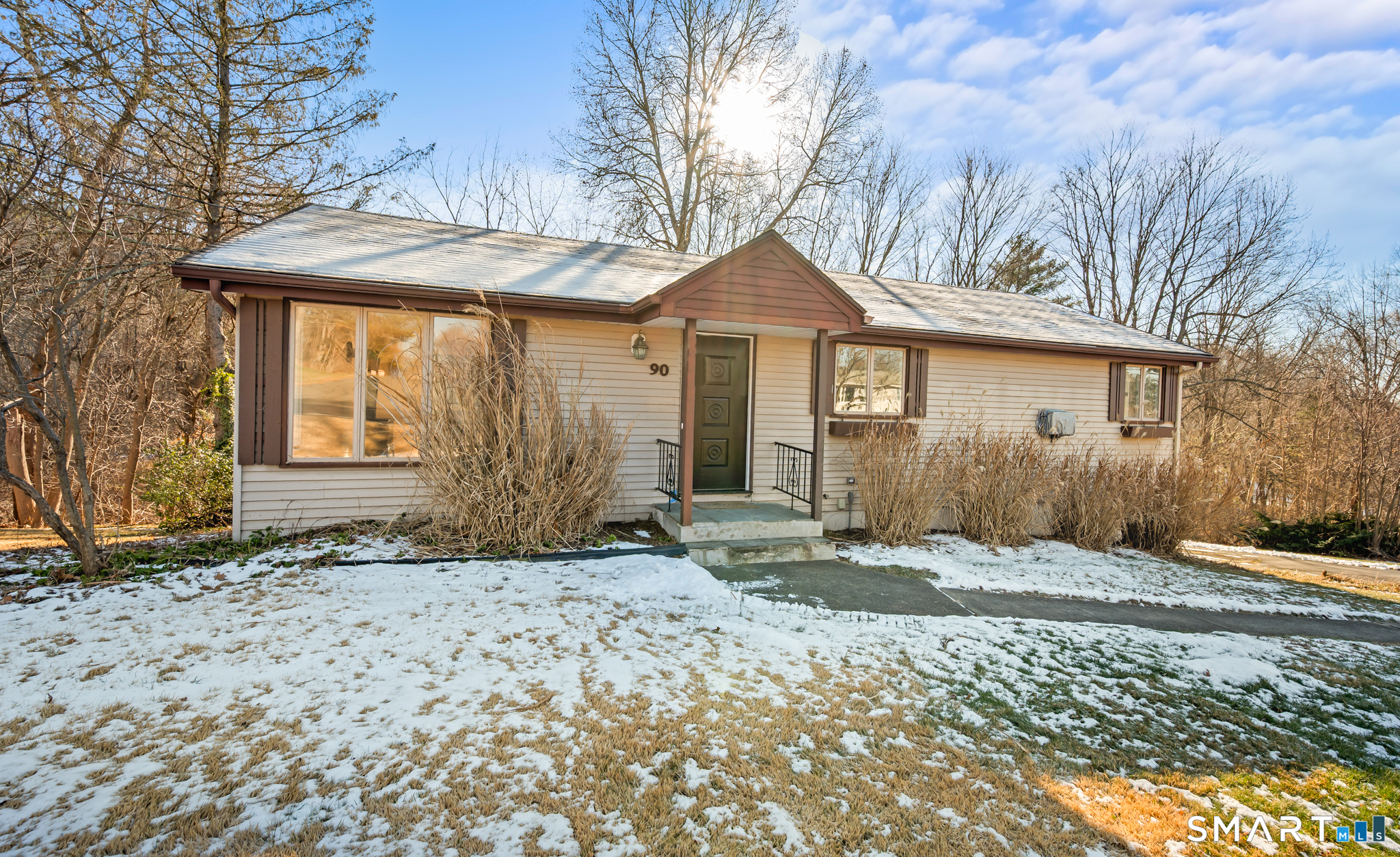 90 Pinnacle Road Plainville, CT 06062 - Photo 35 of 38 a front view of a house with a yard and garage