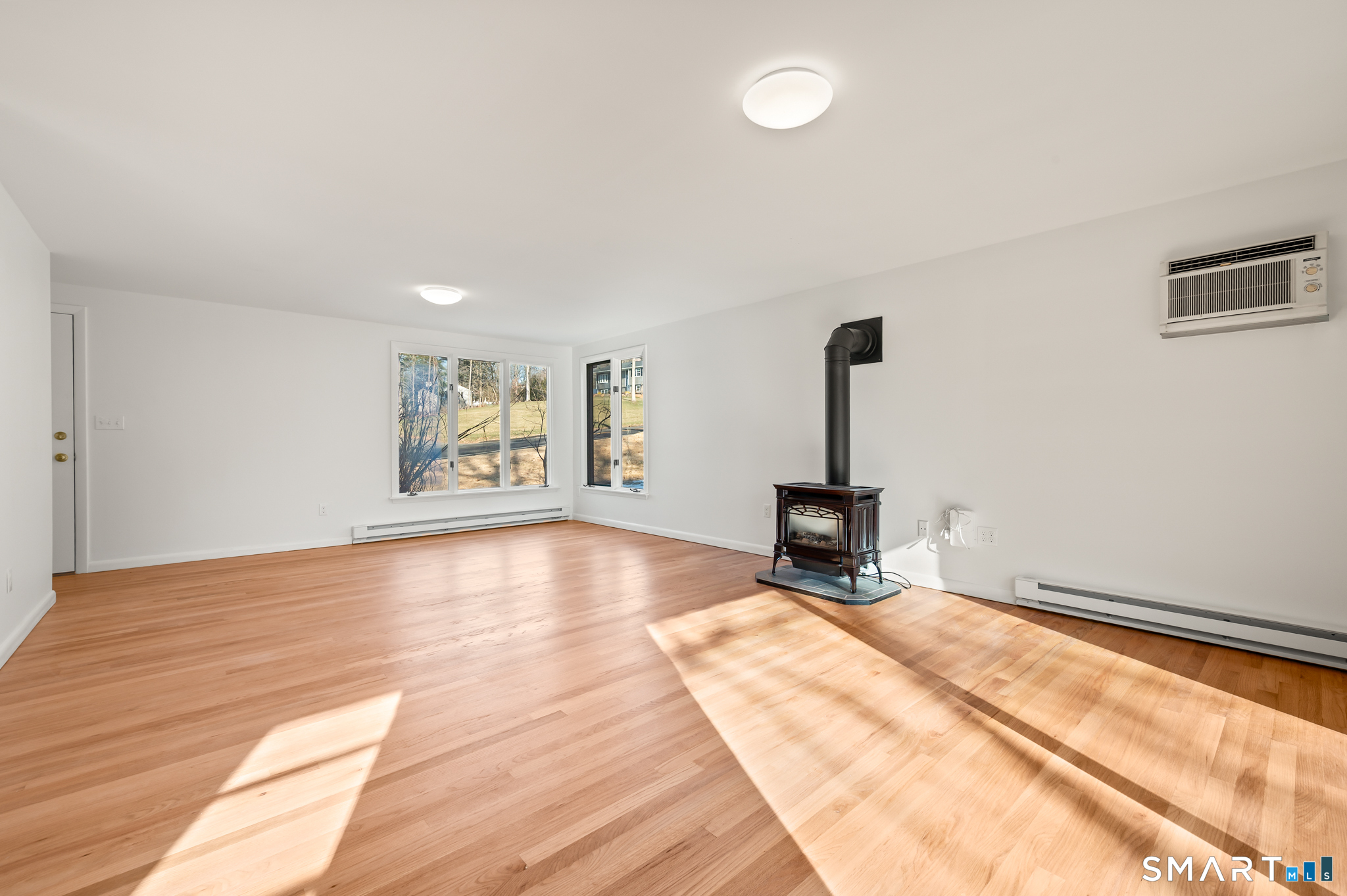 90 Pinnacle Road Plainville, CT 06062 - Photo 5 of 38 a view of an empty room with window