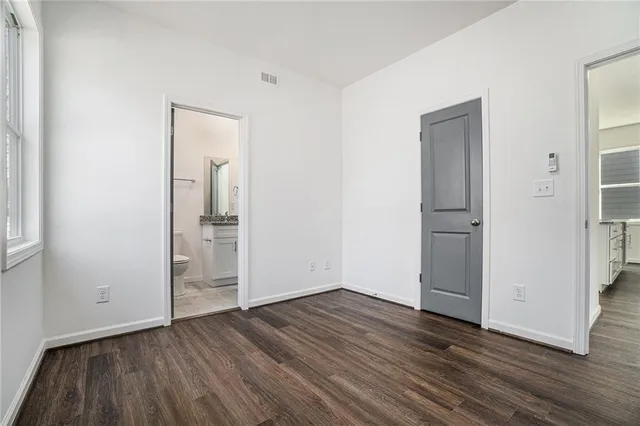 a view of backyard with a chair and roof deck