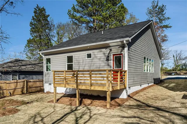 a view of a chairs and table in the backyard