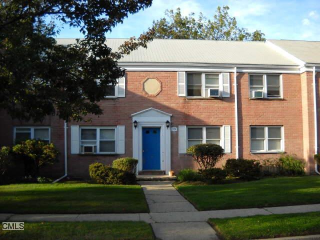 228 Seaton Road, Unit 4 Stamford, CT 06902 - Photo 1 of 1 a front view of a house with a yard