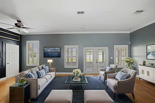 a living room with furniture and windows