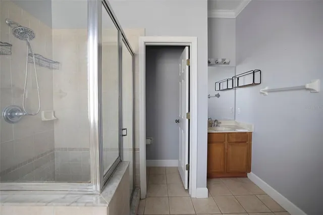 a bathroom with a shower and a sink