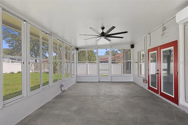 a view of a big room with windows