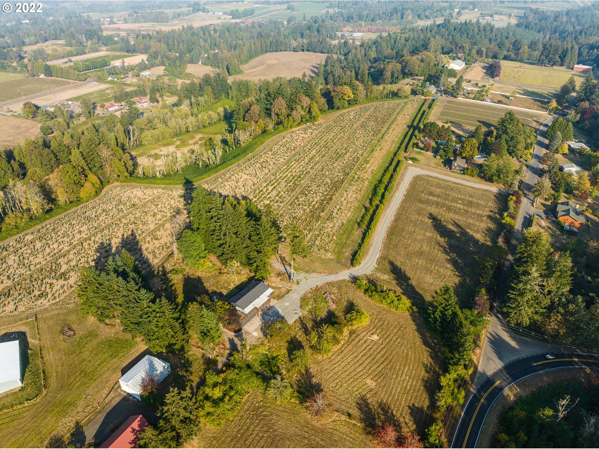 an aerial view of residential houses with outdoor space