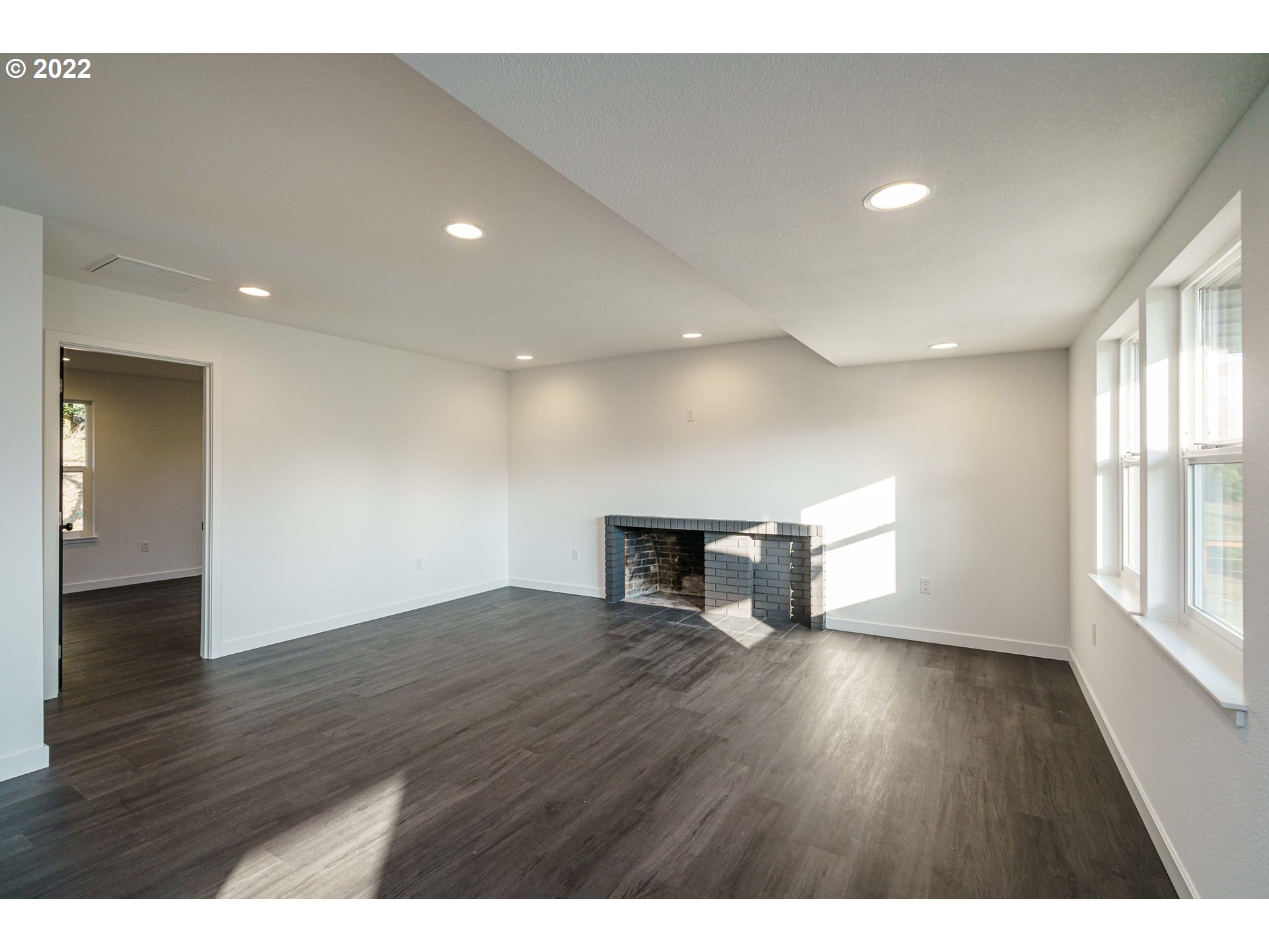 28371 Southeast KW Anderson Road Gresham, OR 97080 - Photo 13 of 32 a view of empty room with wooden floor and fan
