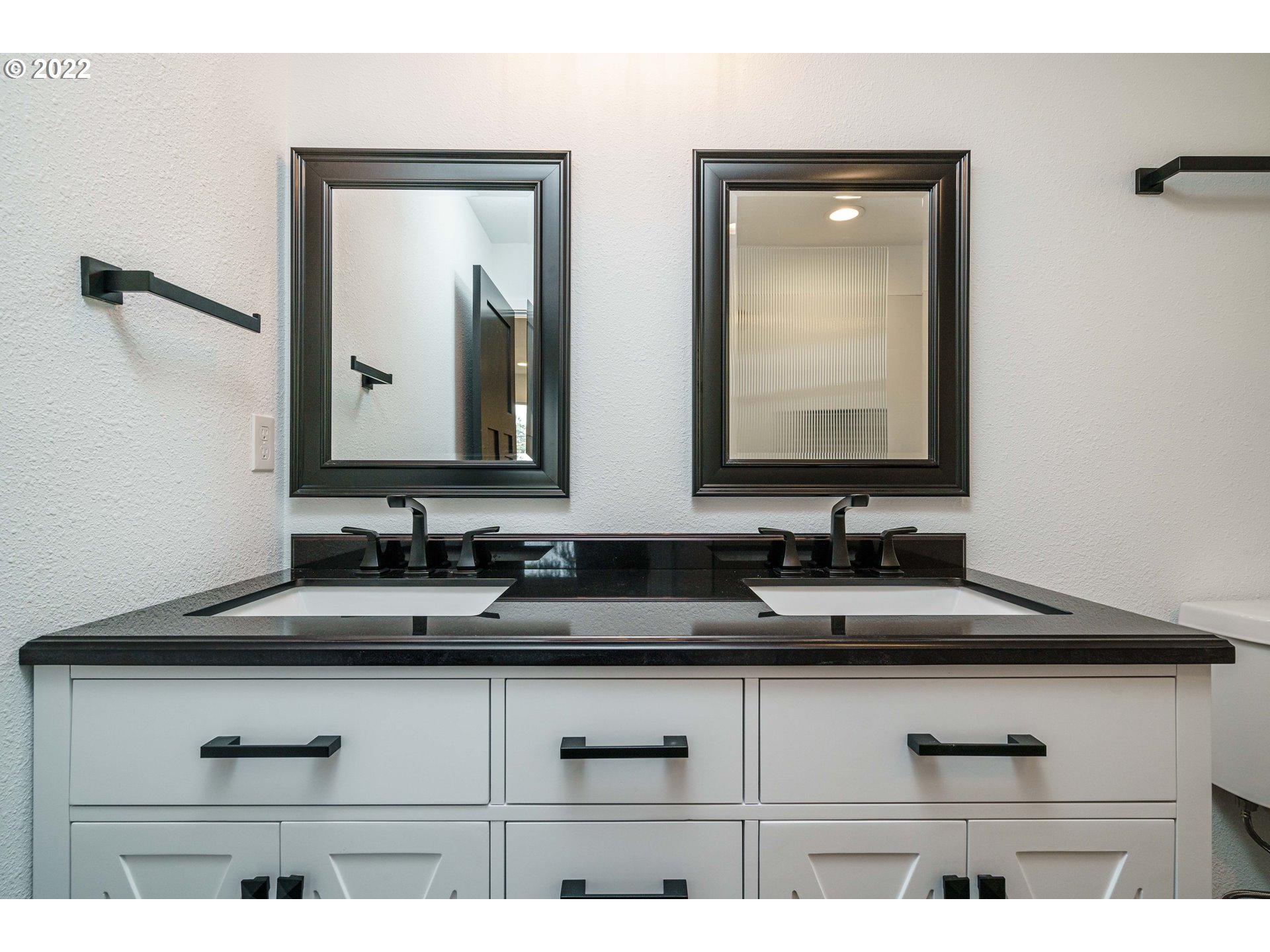 28371 Southeast KW Anderson Road Gresham, OR 97080 - Photo 15 of 32 a bathroom with double sink and a mirror