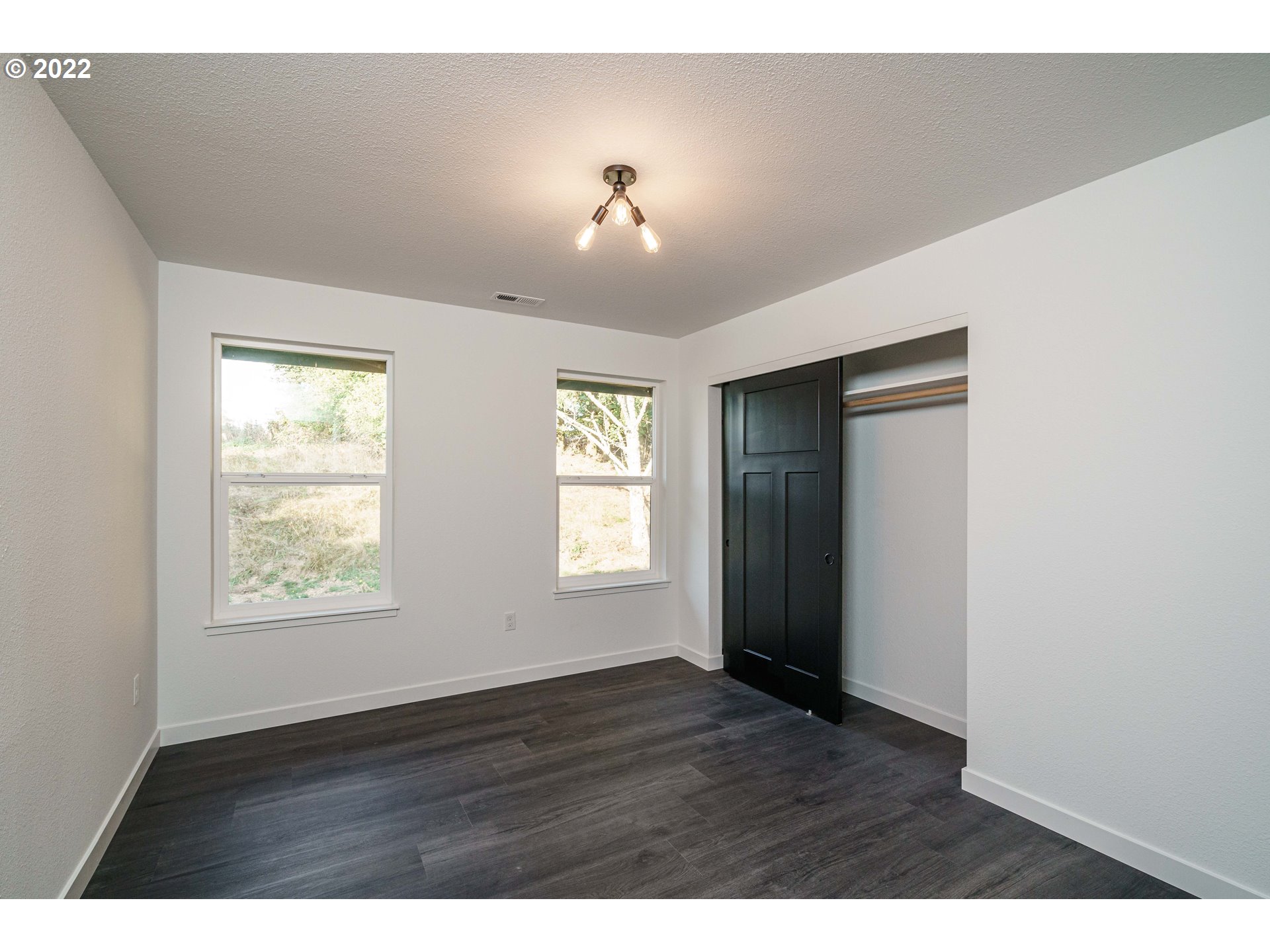 28371 Southeast KW Anderson Road Gresham, OR 97080 - Photo 19 of 32 a view of an empty room with a window