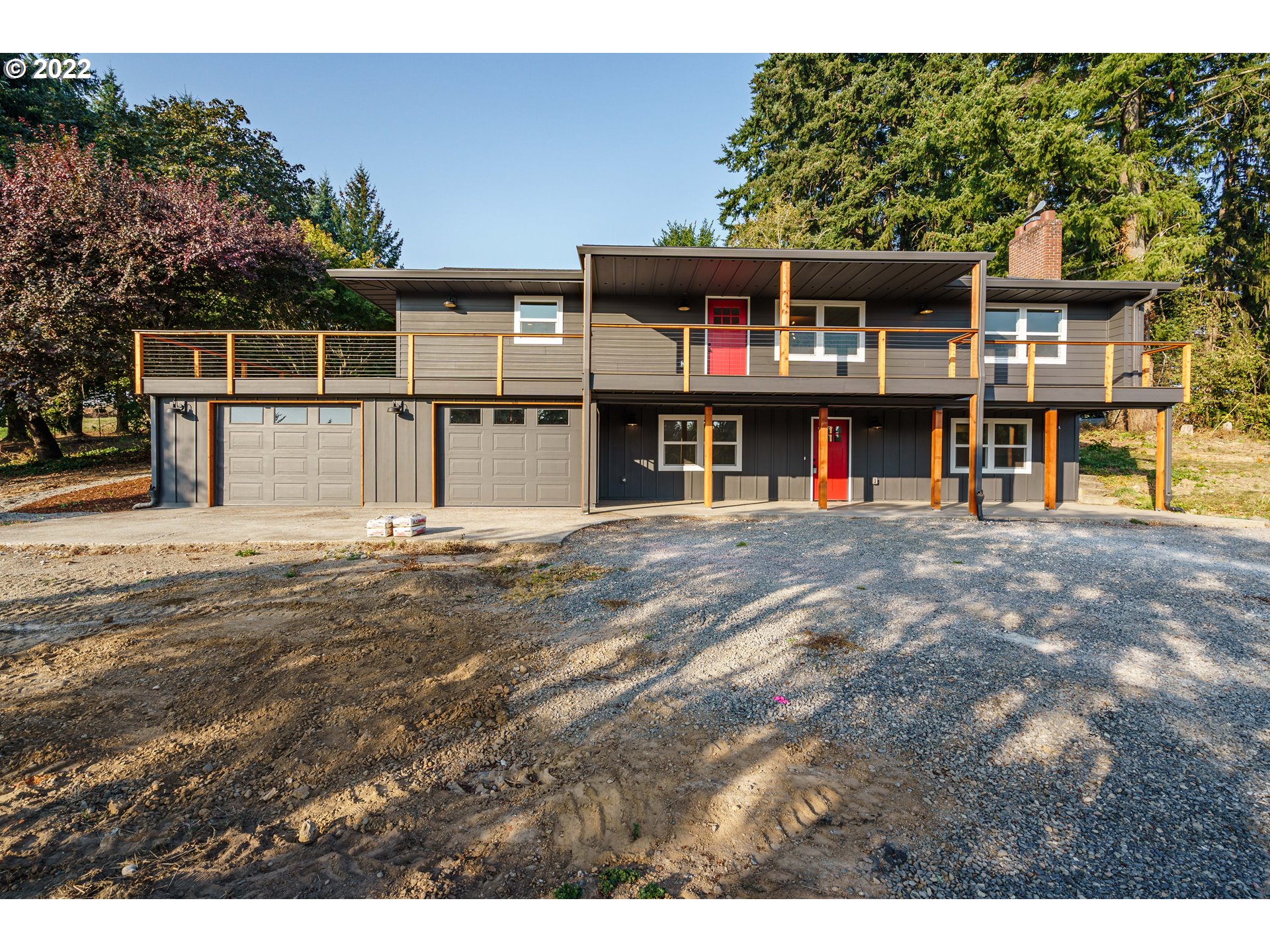 28371 Southeast KW Anderson Road Gresham, OR 97080 - Photo 3 of 32 a front view of a house with large windows
