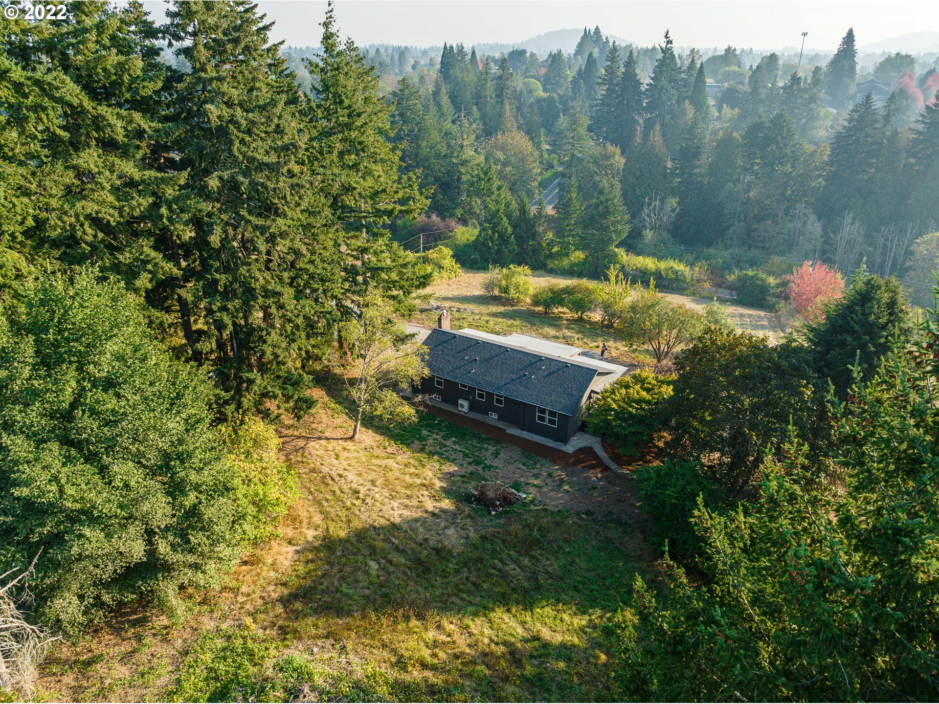 28371 Southeast KW Anderson Road Gresham, OR 97080 - Photo 31 of 32 a view of a backyard with plants and a garden