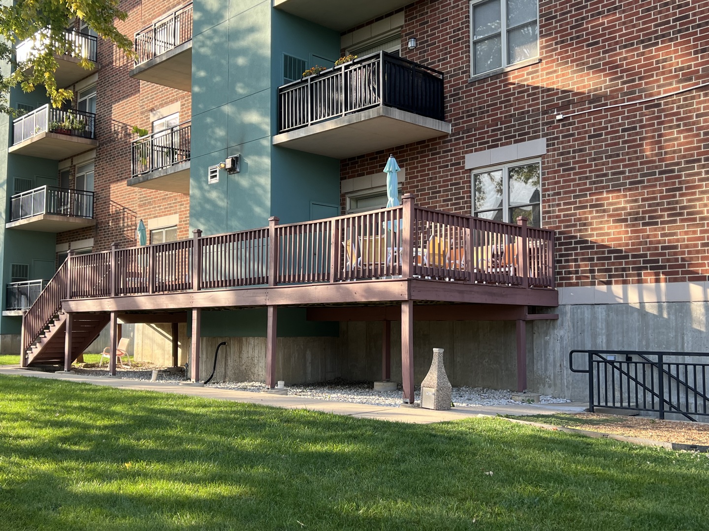 9355 Irving Park Road, Unit 522 Schiller Park, IL 60176 - Photo 19 of 24 a view of a house with a yard and a large tree
