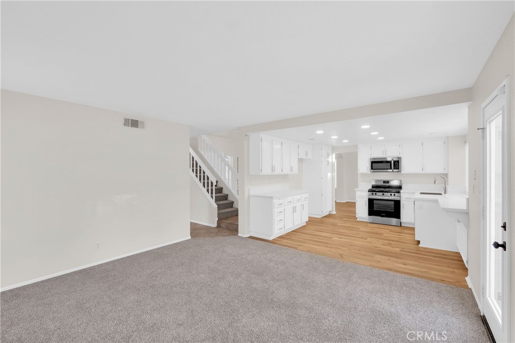 9253 Sunridge Drive Riverside, CA 92508 - Photo 14 of 54 a view of a kitchen with a sink cabinets and a kitchen