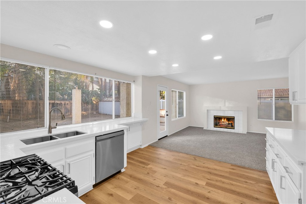 9253 Sunridge Drive Riverside, CA 92508 - Photo 15 of 54 a large white kitchen with sink and cabinets