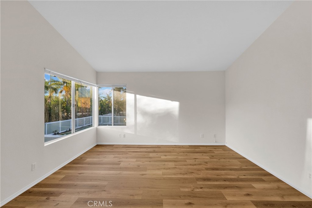 9253 Sunridge Drive Riverside, CA 92508 - Photo 26 of 54 a view of empty room with wooden floor and fan