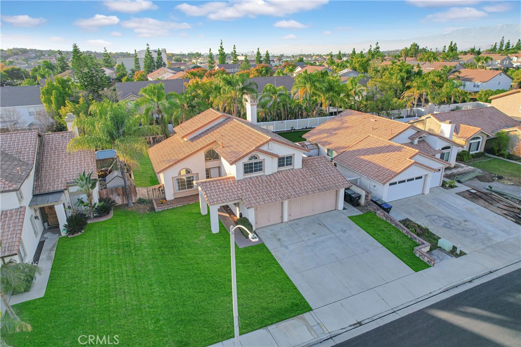9253 Sunridge Drive Riverside, CA 92508 - Photo 51 of 54 an aerial view of residential houses with outdoor space and trees