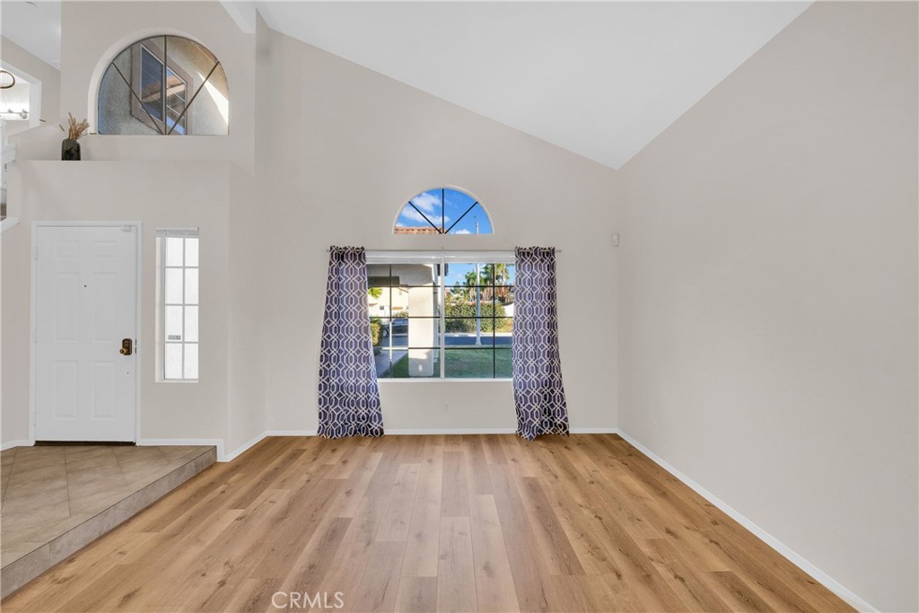 9253 Sunridge Drive Riverside, CA 92508 - Photo 7 of 54 a view of empty room with wooden floor and fan