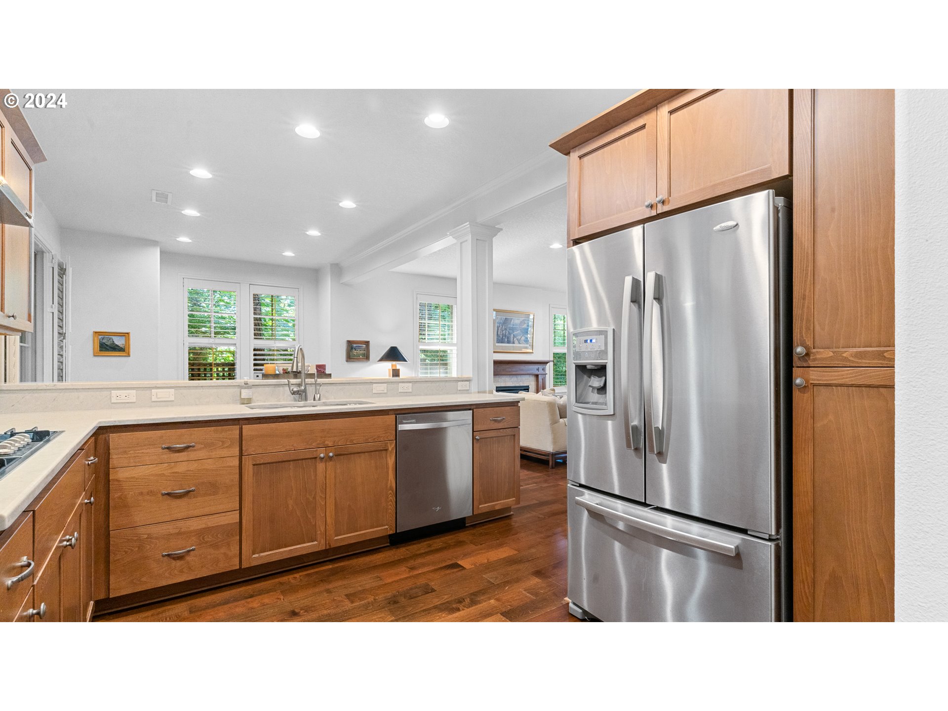 4511 Oakridge Road Lake Oswego, OR 97035 - Photo 12 of 44 a kitchen with a refrigerator a sink and cabinets
