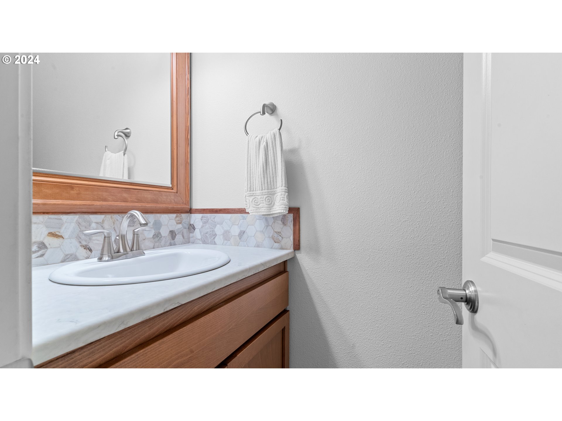 4511 Oakridge Road Lake Oswego, OR 97035 - Photo 14 of 44 a bathroom with a sink and a mirror