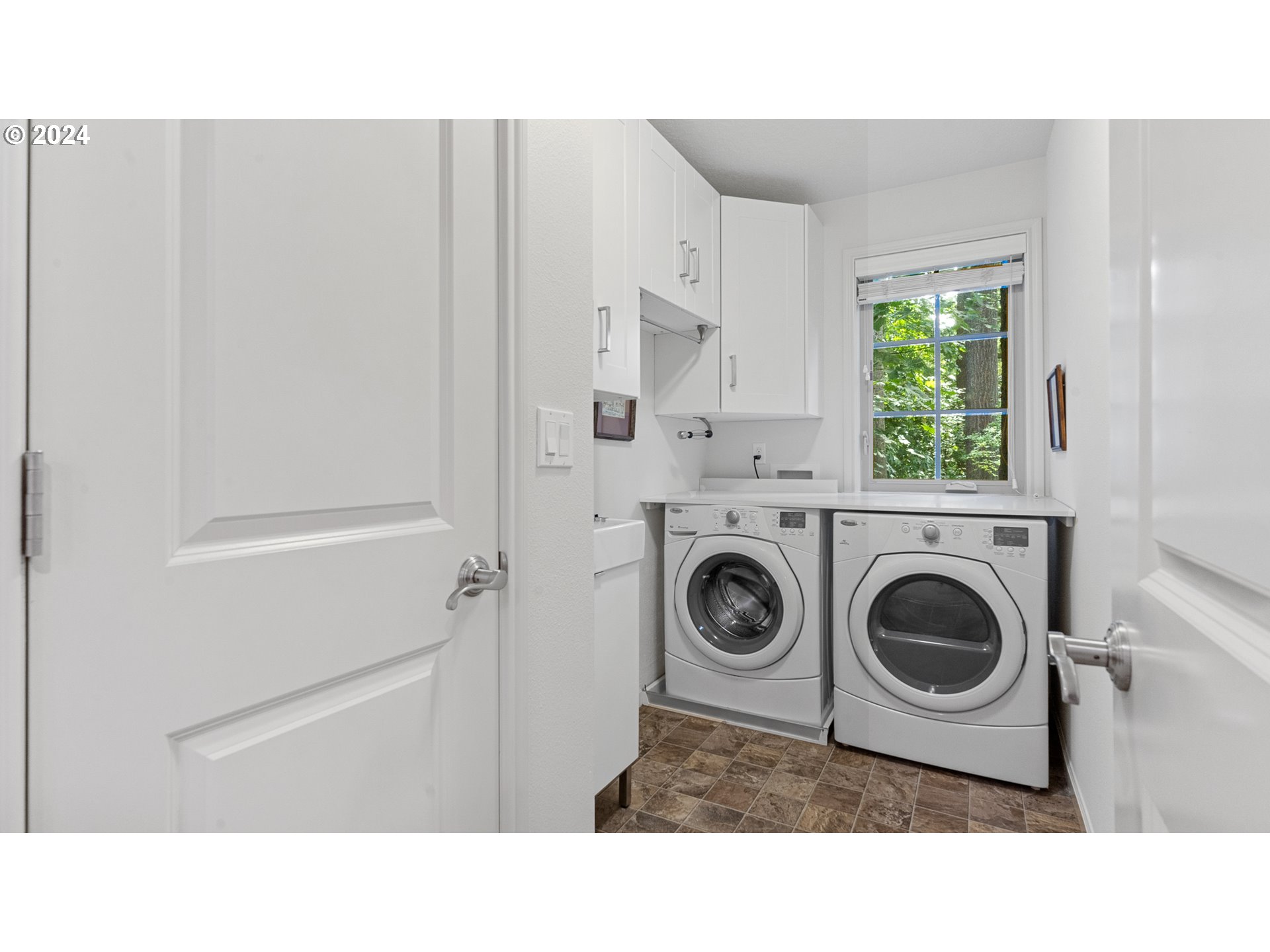 4511 Oakridge Road Lake Oswego, OR 97035 - Photo 32 of 44 a bathroom with a sink a washer and dryer