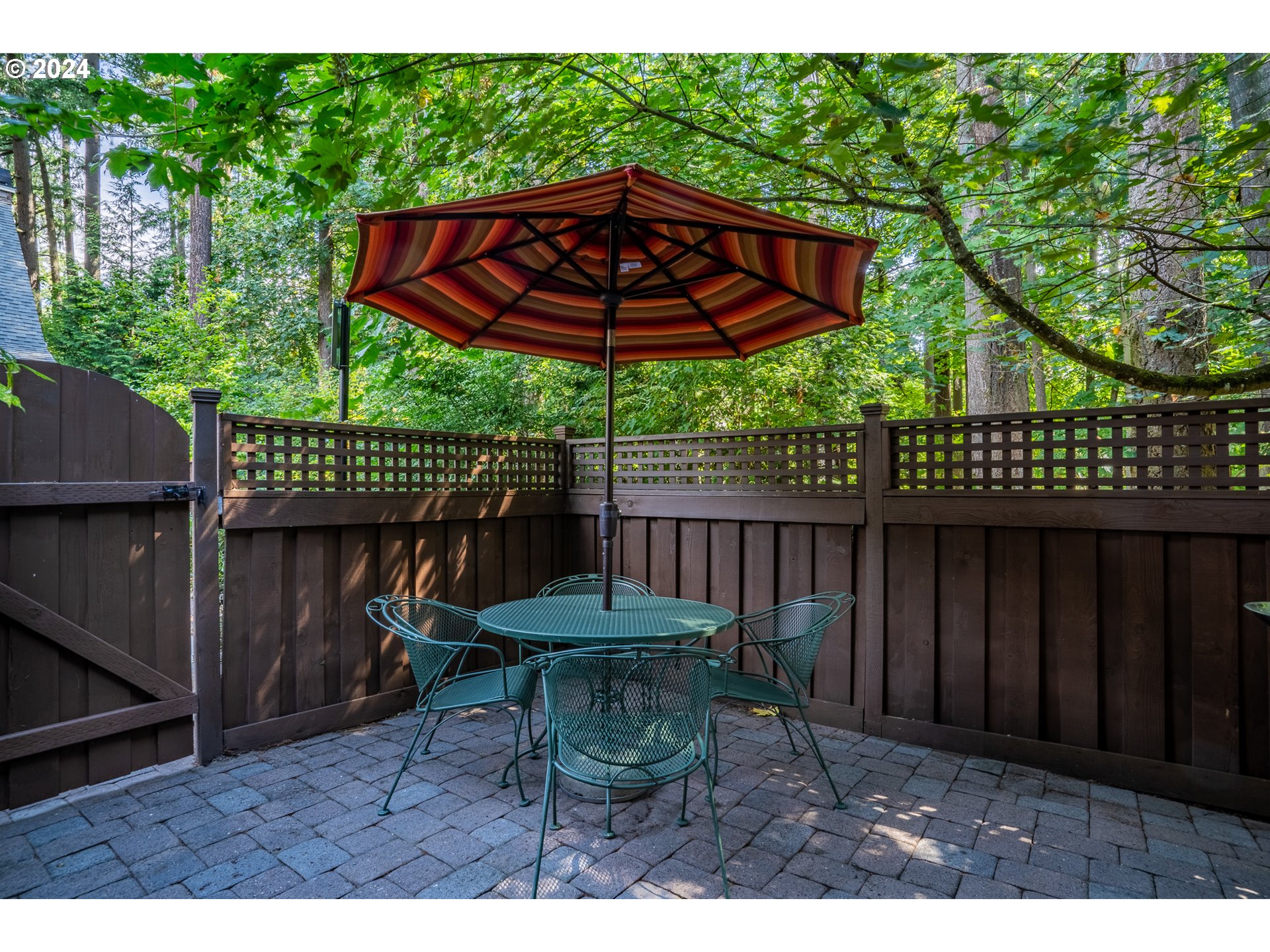 4511 Oakridge Road Lake Oswego, OR 97035 - Photo 33 of 44 a view of a table and chairs under an umbrella