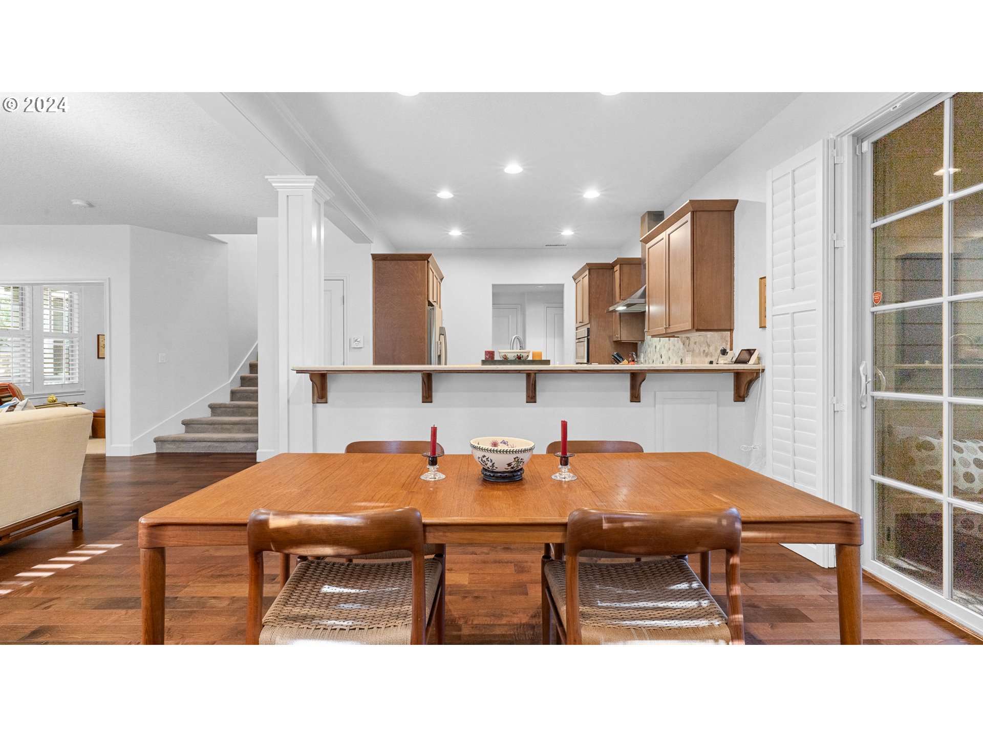 4511 Oakridge Road Lake Oswego, OR 97035 - Photo 8 of 44 a kitchen with stainless steel appliances kitchen island granite countertop a sink and white cabinets