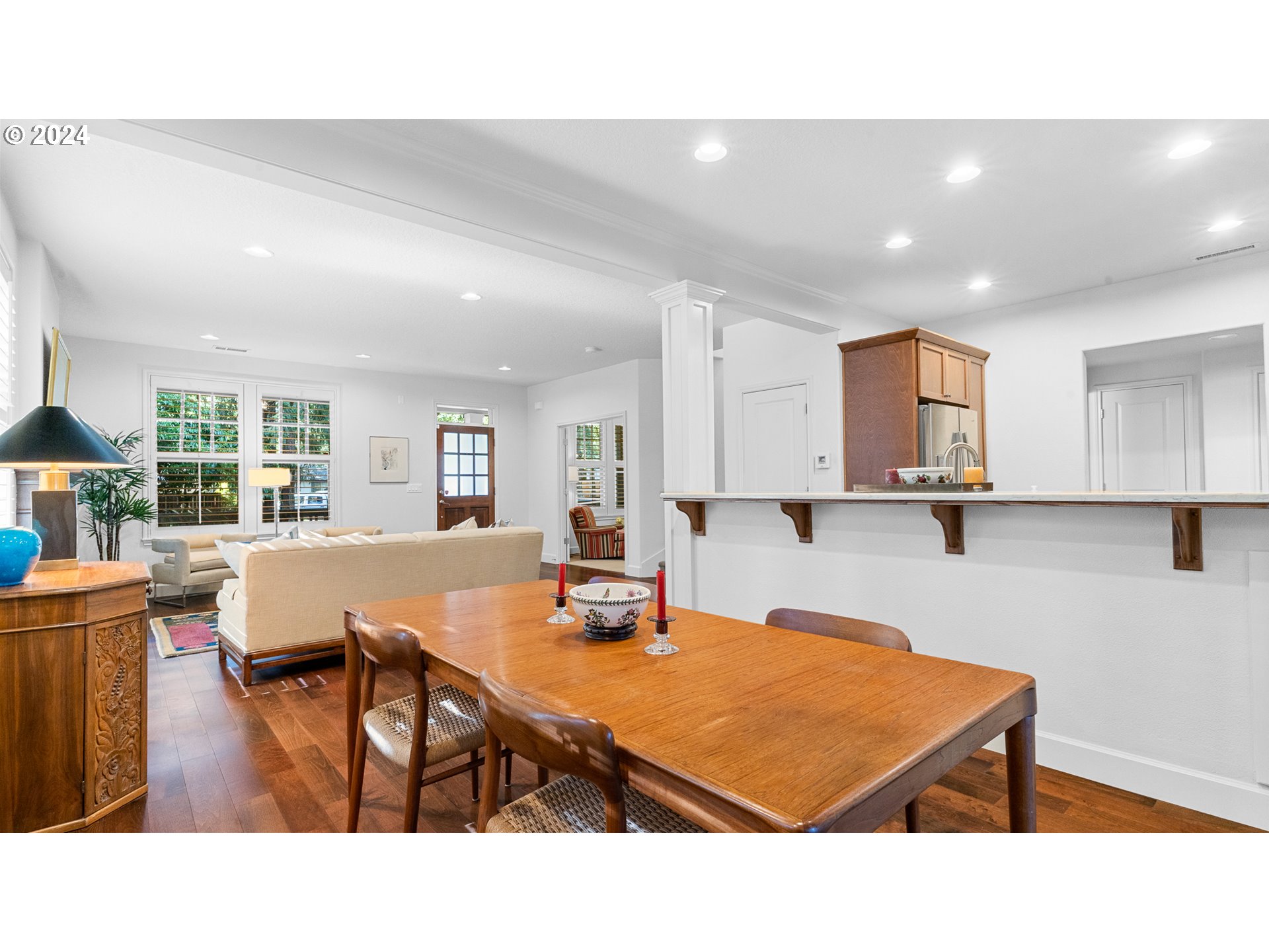 4511 Oakridge Road Lake Oswego, OR 97035 - Photo 9 of 44 a kitchen with a table chairs refrigerator and microwave