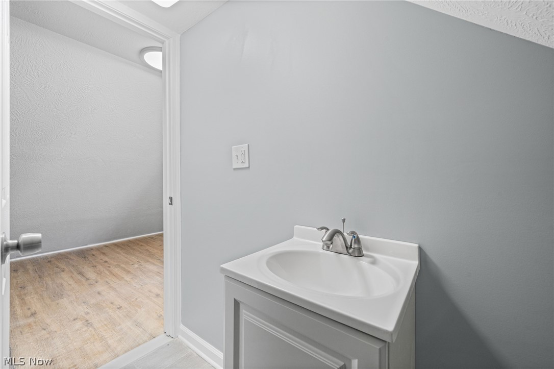 3925 Riverside Avenue Cleveland, OH 44109 - Photo 40 of 48 Bathroom vanity with integrated sink and chrome faucet