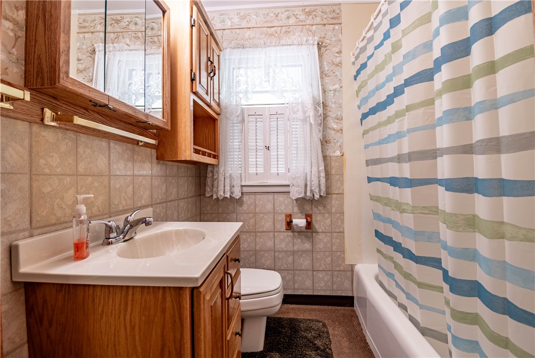 2287 West Cushing Street Decatur, IL 62526 - Photo 10 of 23 a bathroom with a sink toilet and shower
