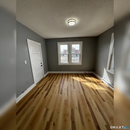 a view of a room that has a window in it