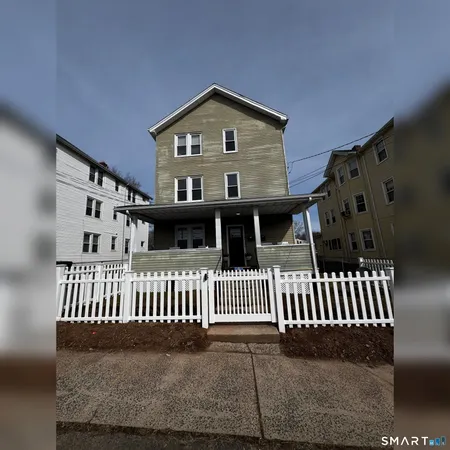 a front view of a house with a porch