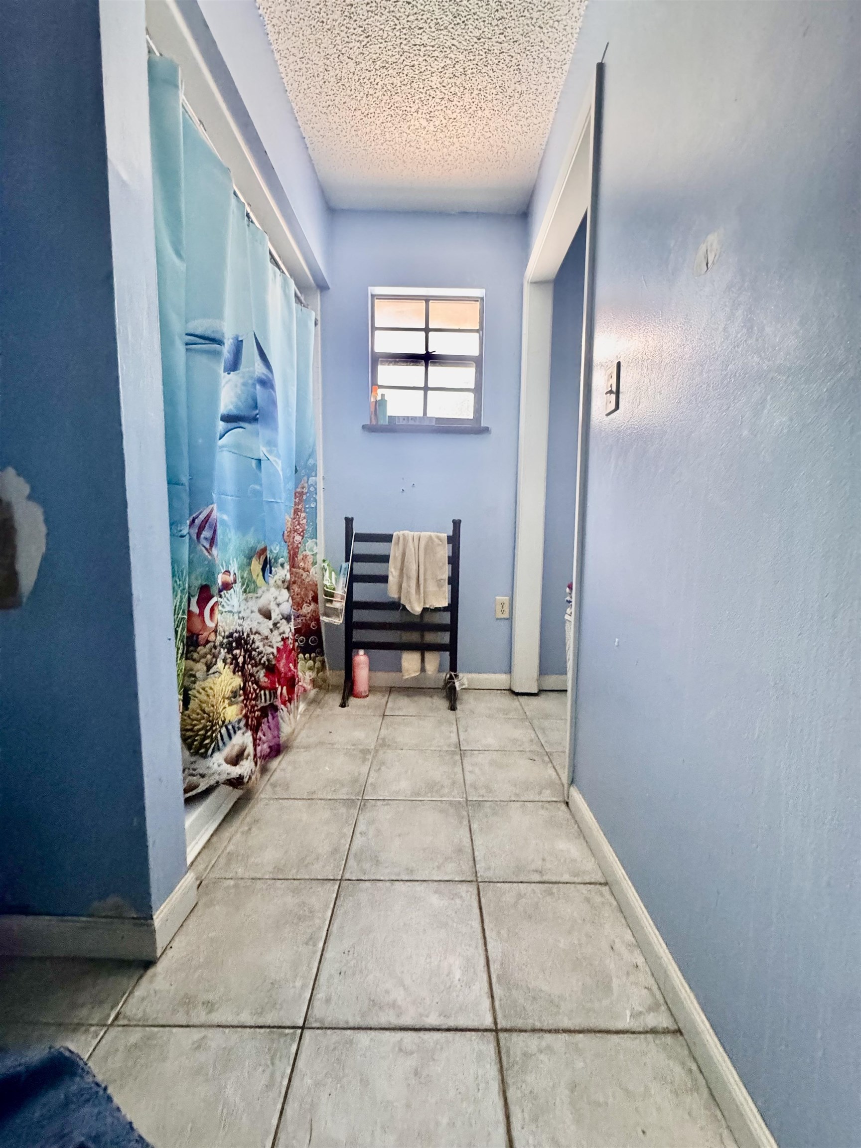554 Hayley Road St. Augustine, FL 32086 - Photo 27 of 46 a view of a hallway and a livingroom with toys